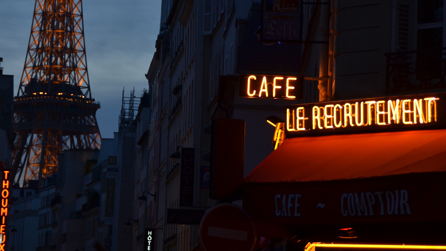 A view of a café behind the Eiffel tower