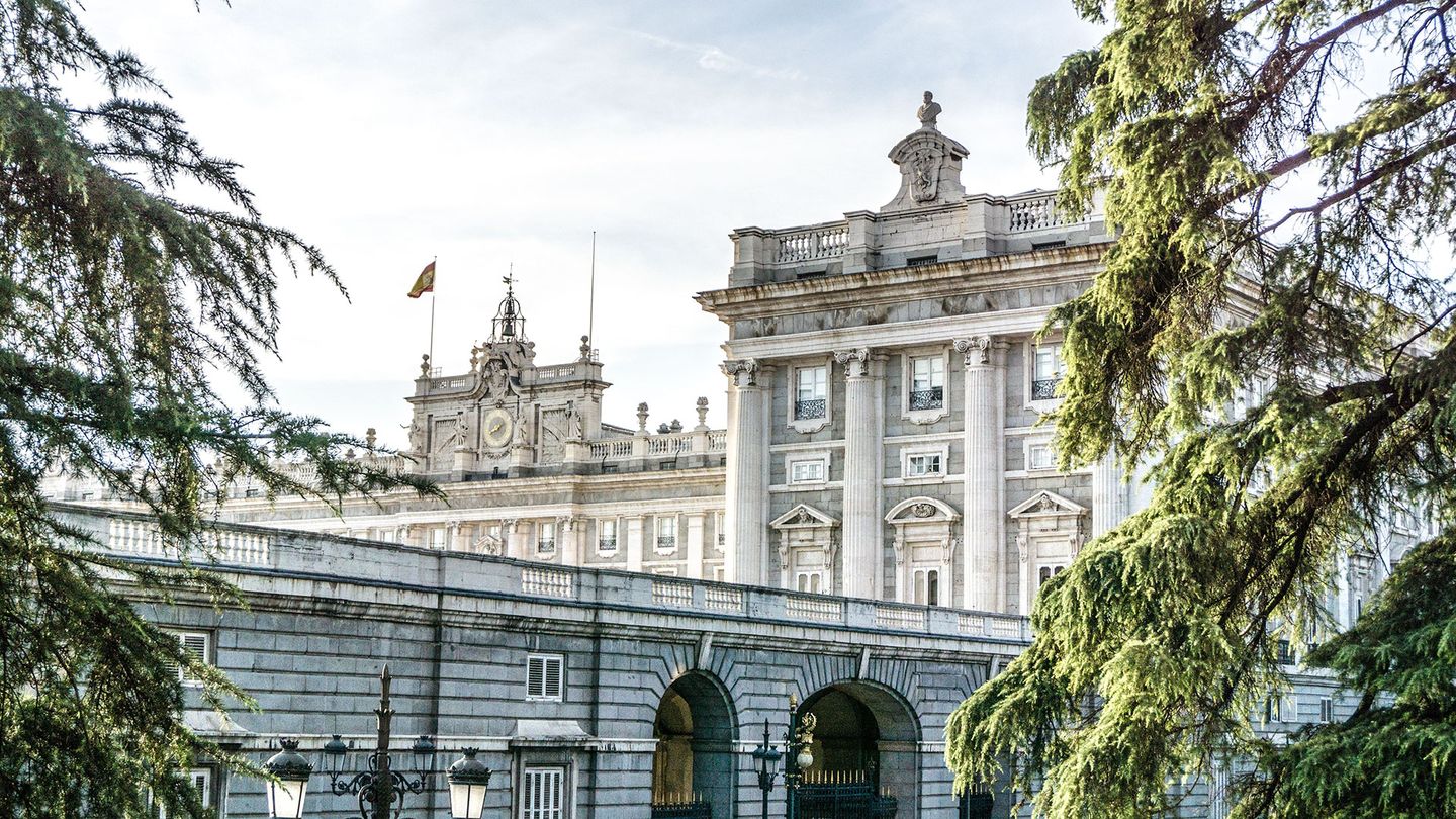 A historical white stone building with columns in Madrid