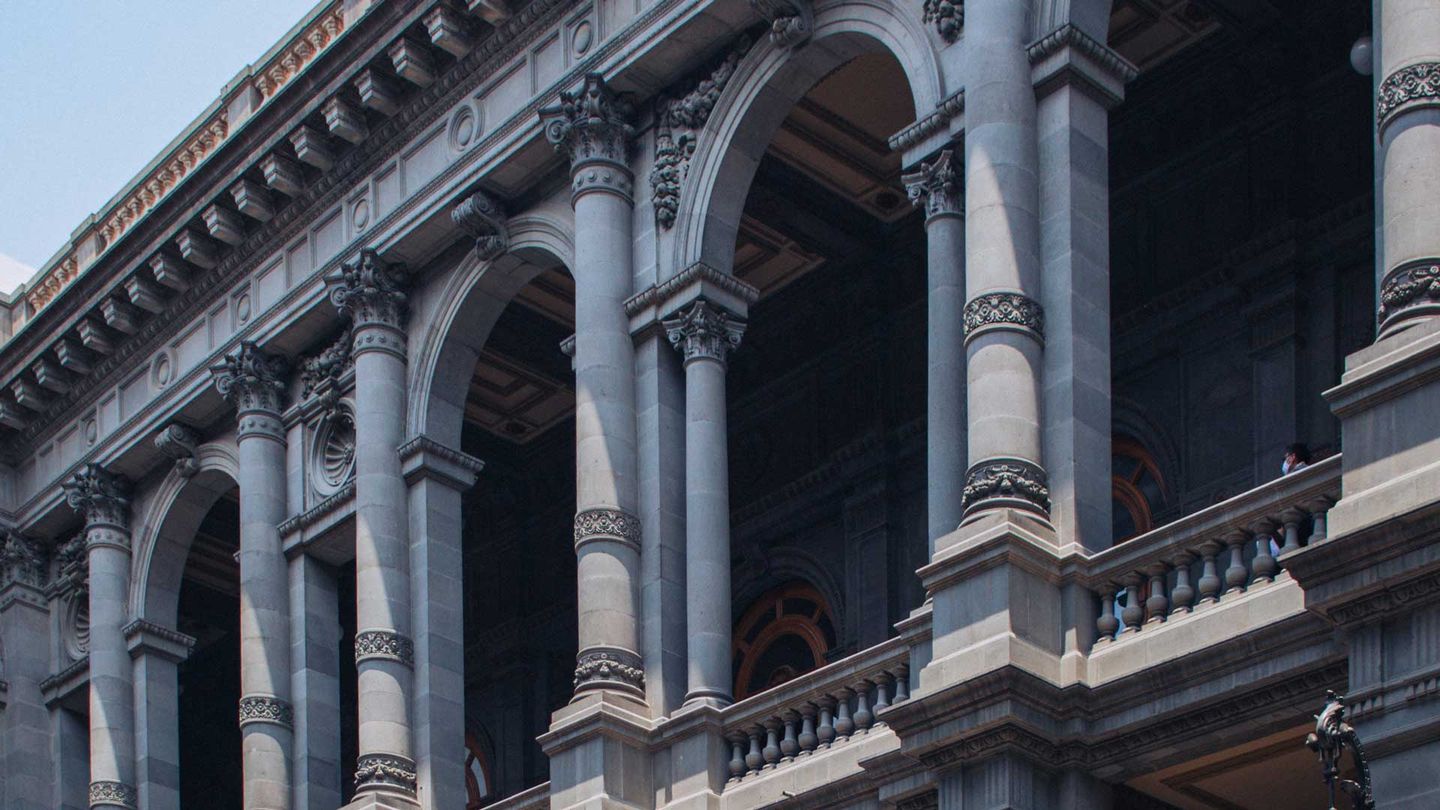 Facade of a ornate decorated place framed by arches