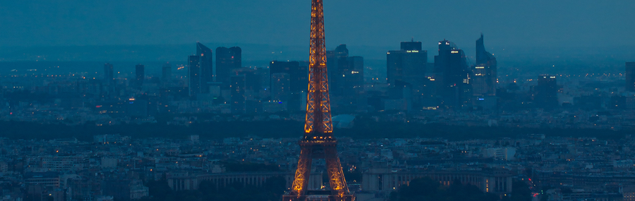 Aerial view of the Eiffel Tower lit up at night