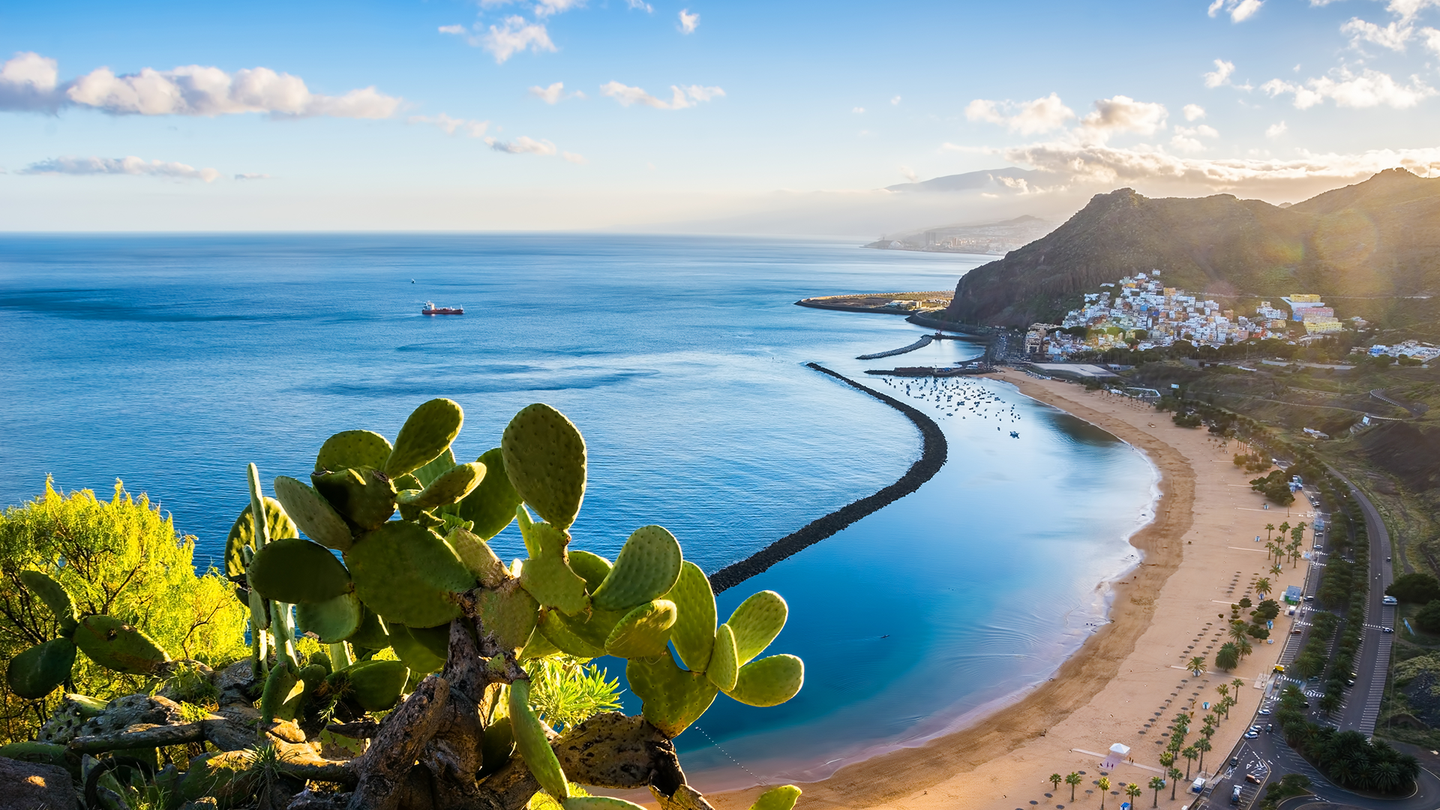 A beautiful landscape view of a coastal city with beaches and boats