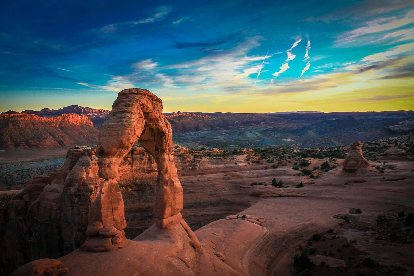 A rock formation shaped like a tall vertical arch in Delicate Arch National Park, Utah