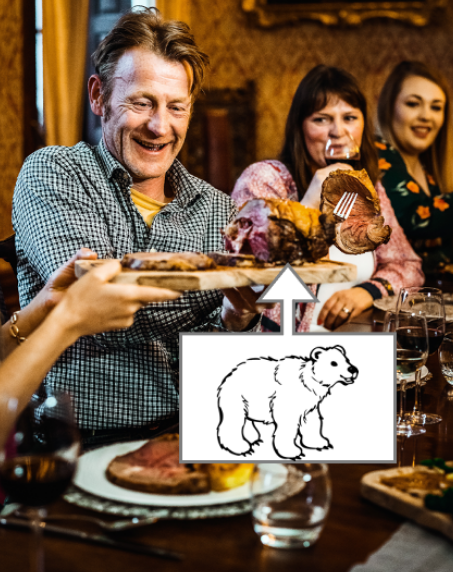 A man eating roasted bear meat