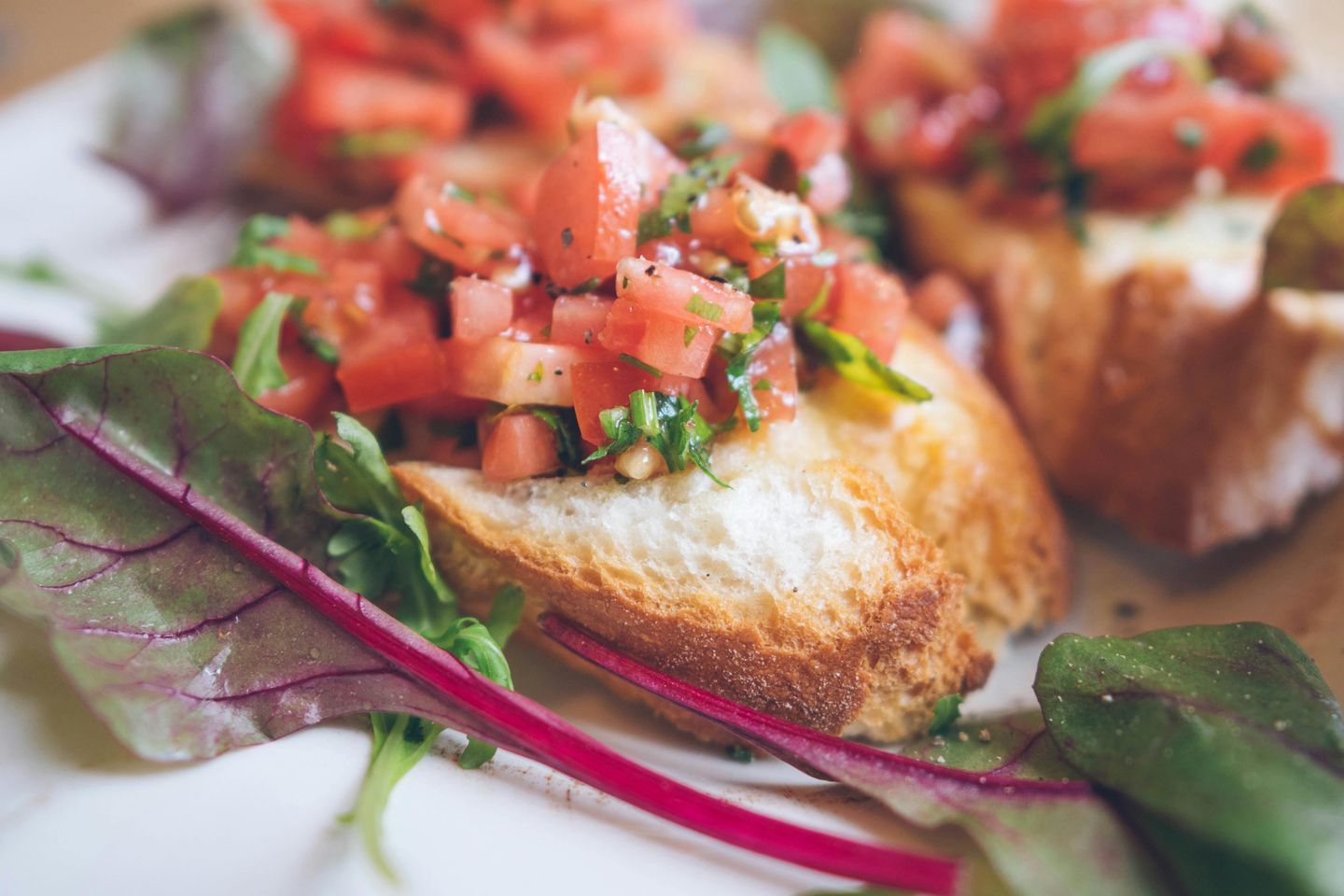 A plate with bruschetta bread on it