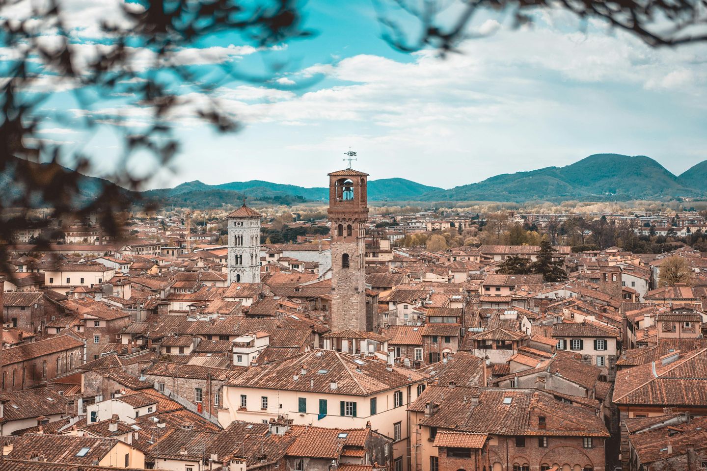 Aerial view of rooftops and bell towers in the city of Lucca, Tuscany