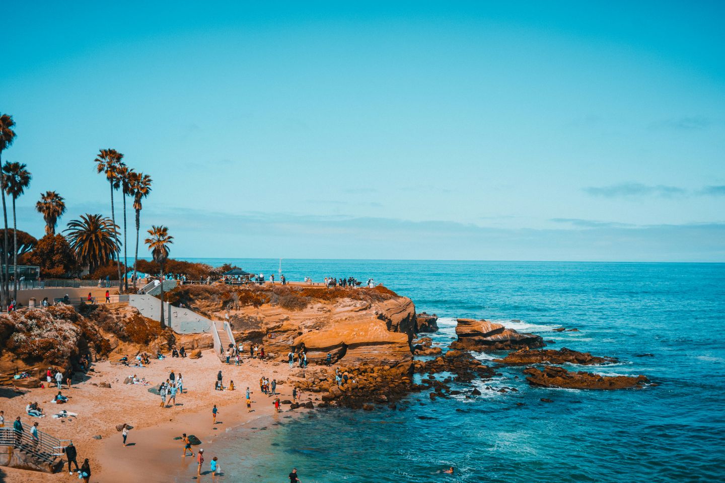 An aerial view of a cliff and beach on the Pacific Ocean, in San Diego California