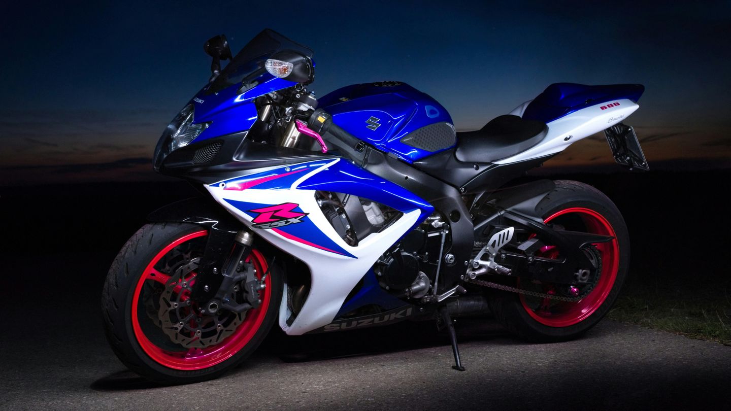 A sporty Japanese motorcycle on display at night