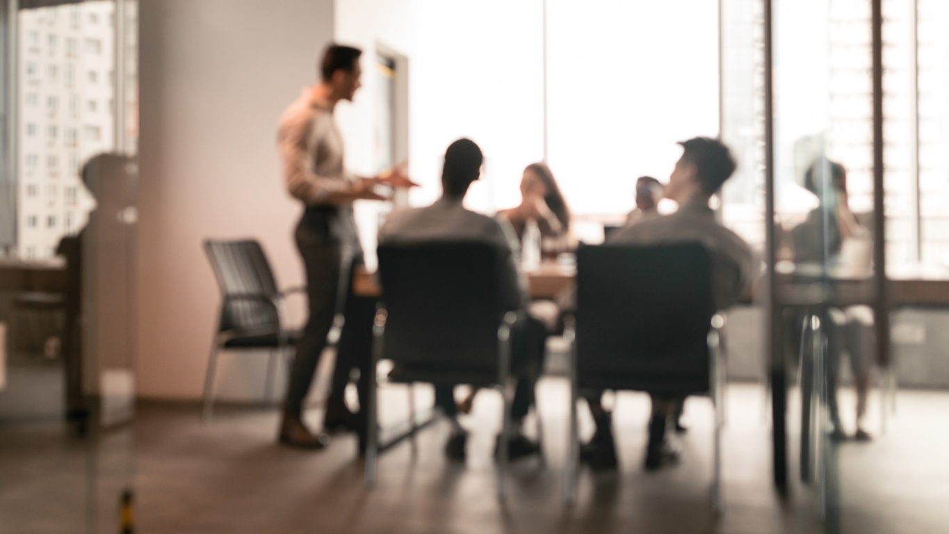 blurry photo of marekting team working on inbound marketing and sales strategies.