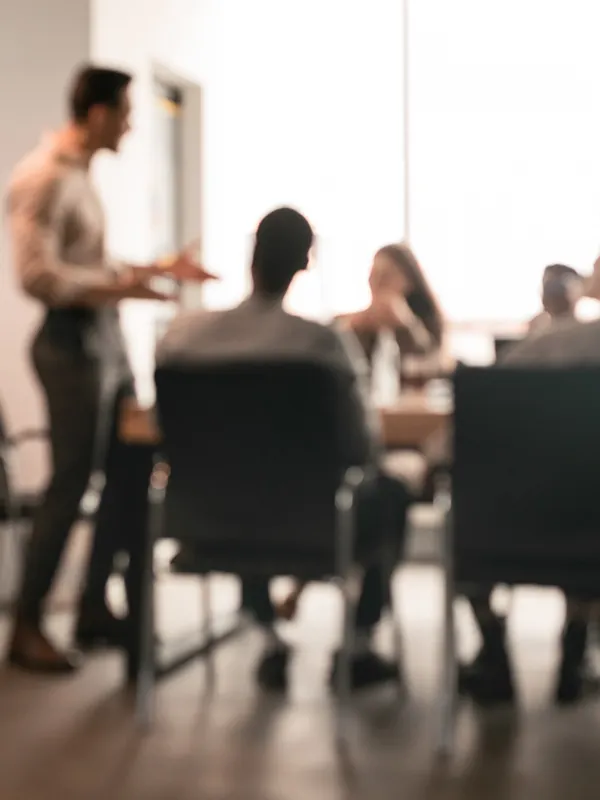 blurry photo of marekting team working on inbound marketing and sales strategies.