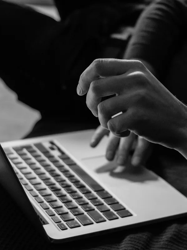 Person using a laptop at work.