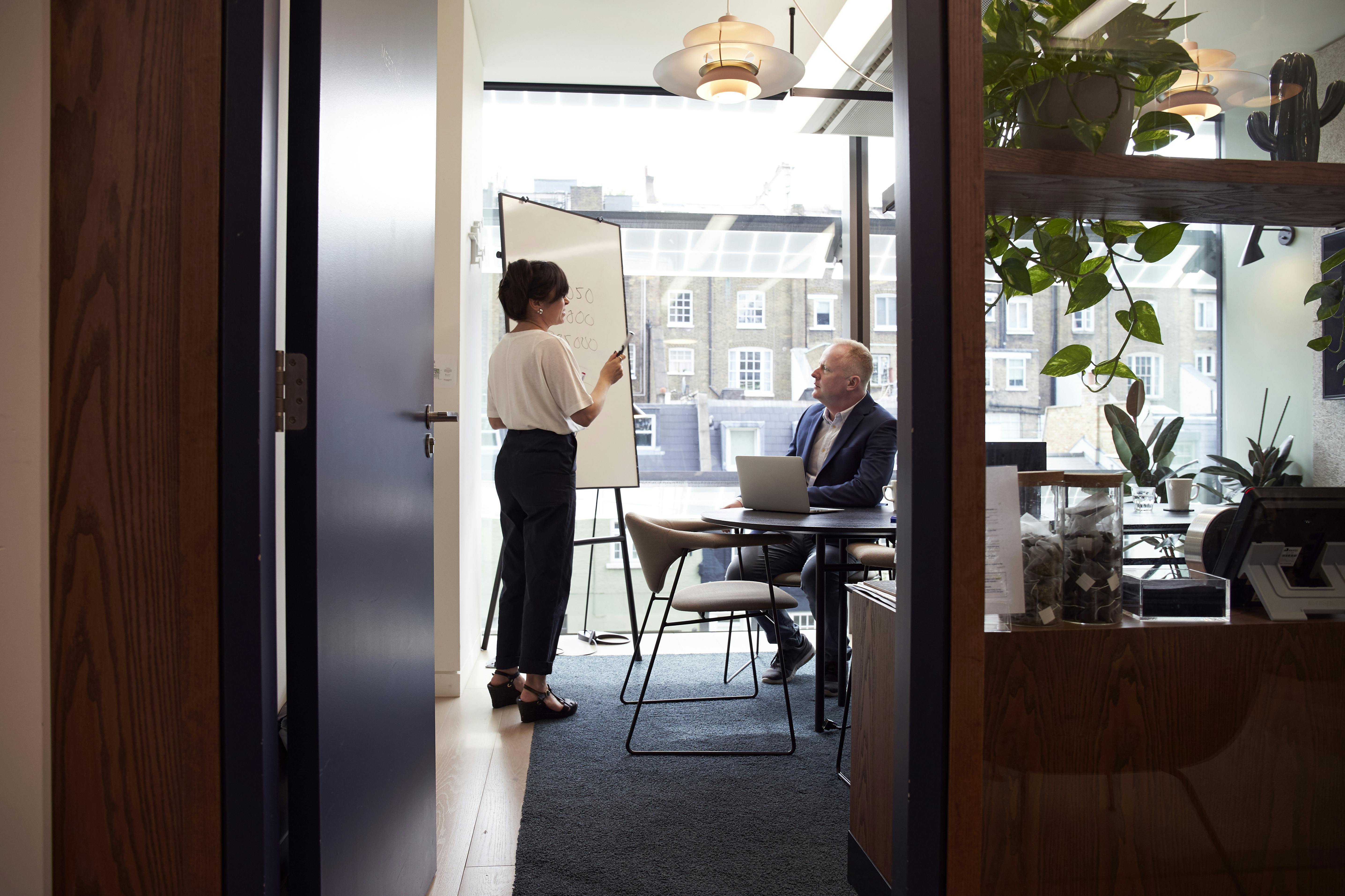 two business people meeting to discuss social media for executive leadership