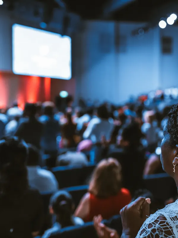 woman sitting at conference