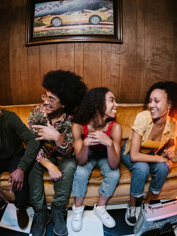 Group of Gen Zers sitting on a couch.