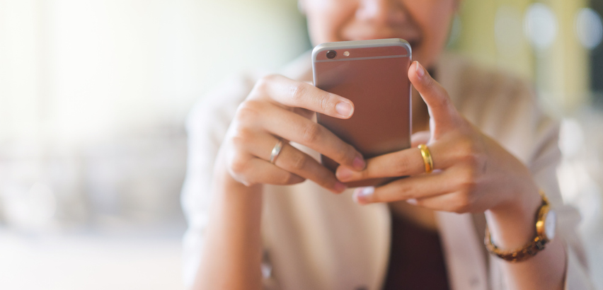 person looking at social media app on their phone