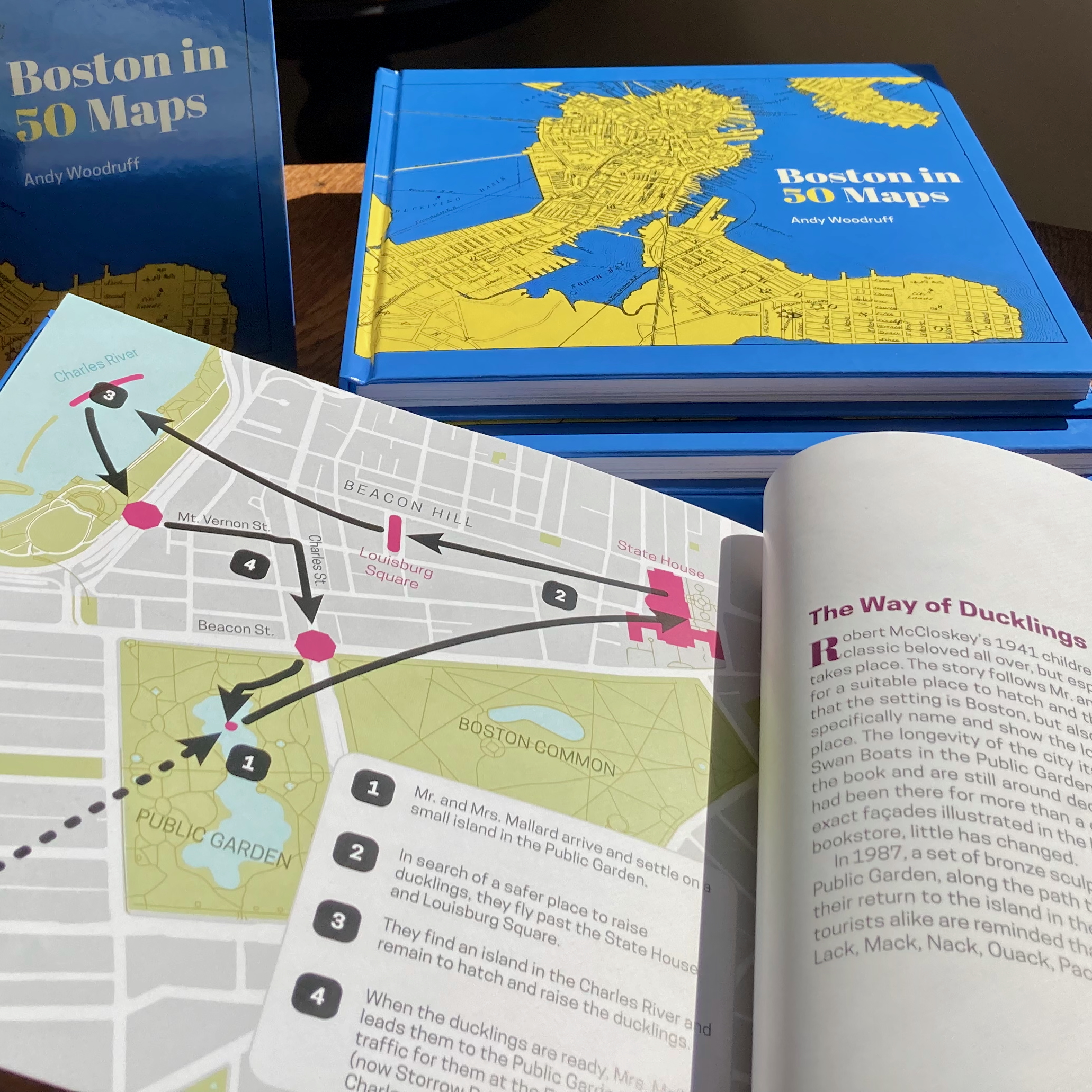 "Boston in 50 Maps" open to a page mapping the route of ducklings