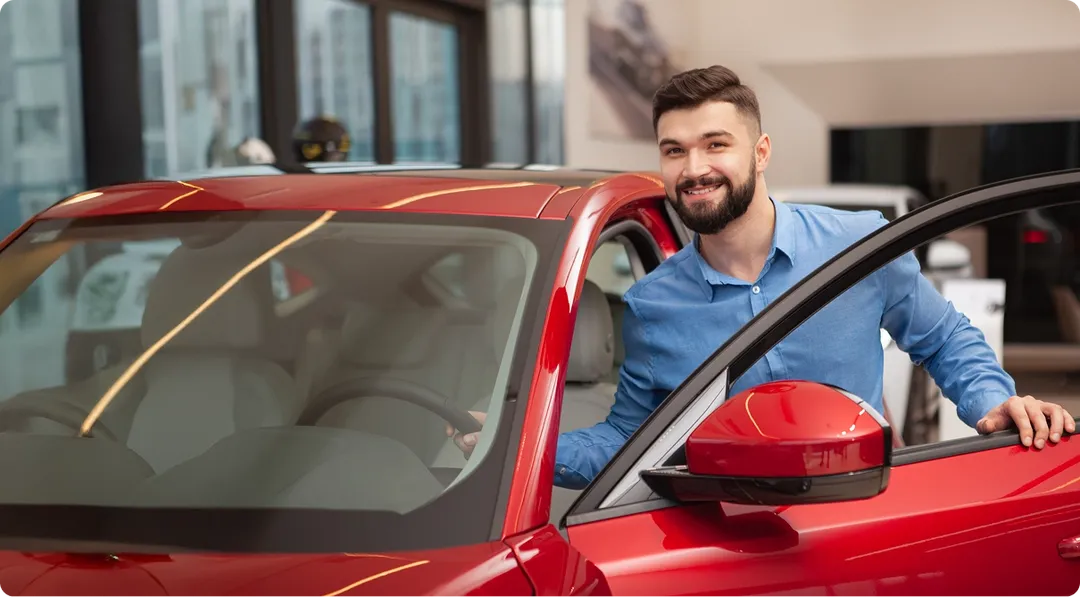 man getting in car