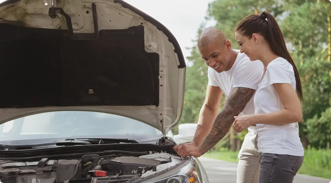 father and daughter working on car