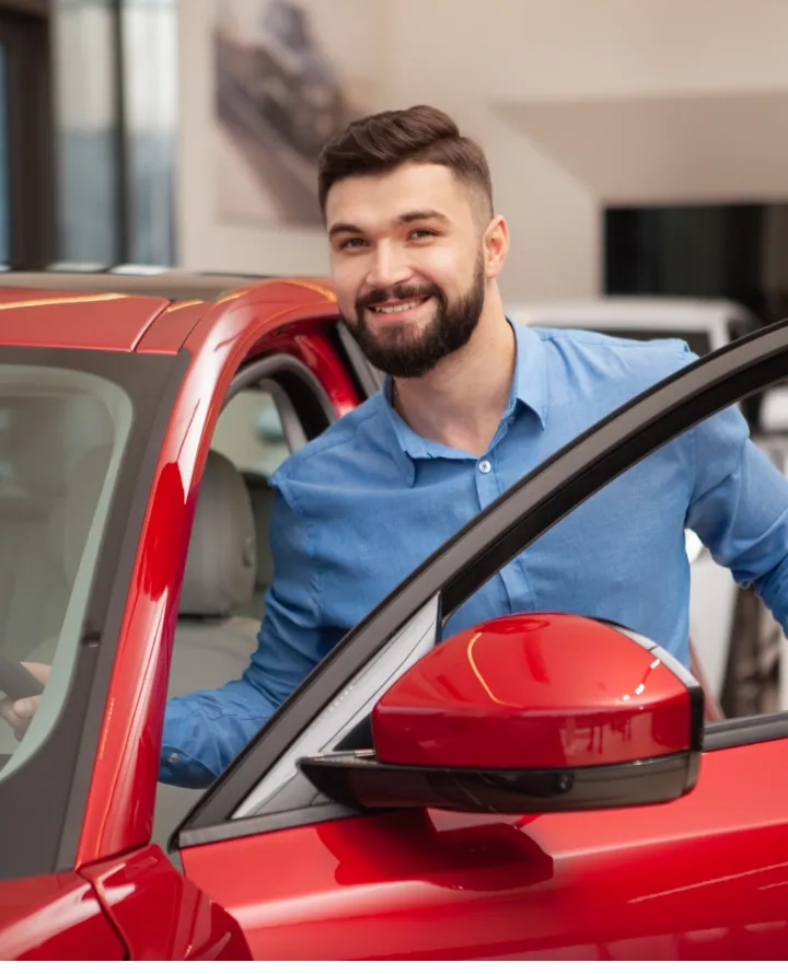man getting in car
