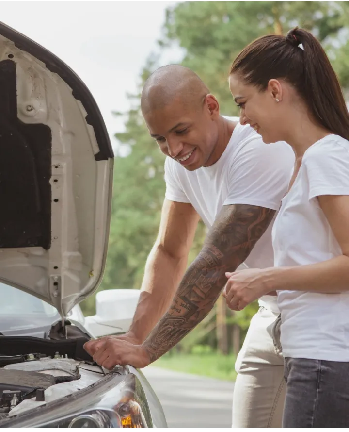 father and daughter working on car