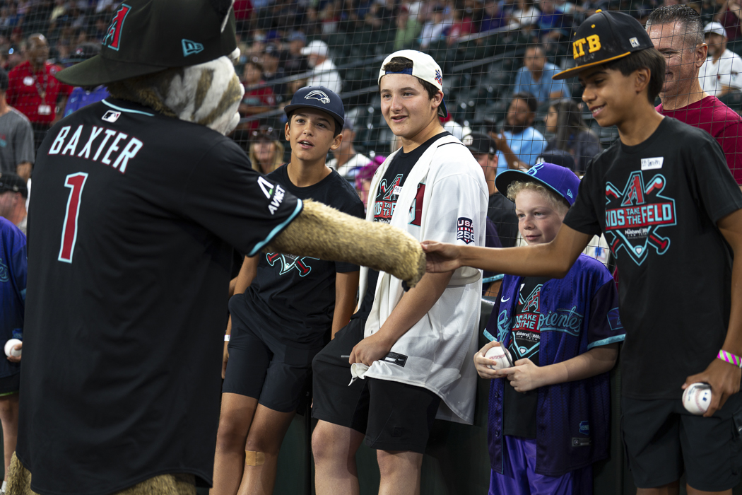 With baseballs in hand and excitement written all over their faces, young Kids Take the Field winners gathered around Baxter, creating memories they'll be talking about long after game day. Excitement was through the roof as Kids Take the Field participants eagerly greeted Baxter, clutching their baseballs and sharing smiles, laughs, and unforgettable moments on the field at Chase Field.