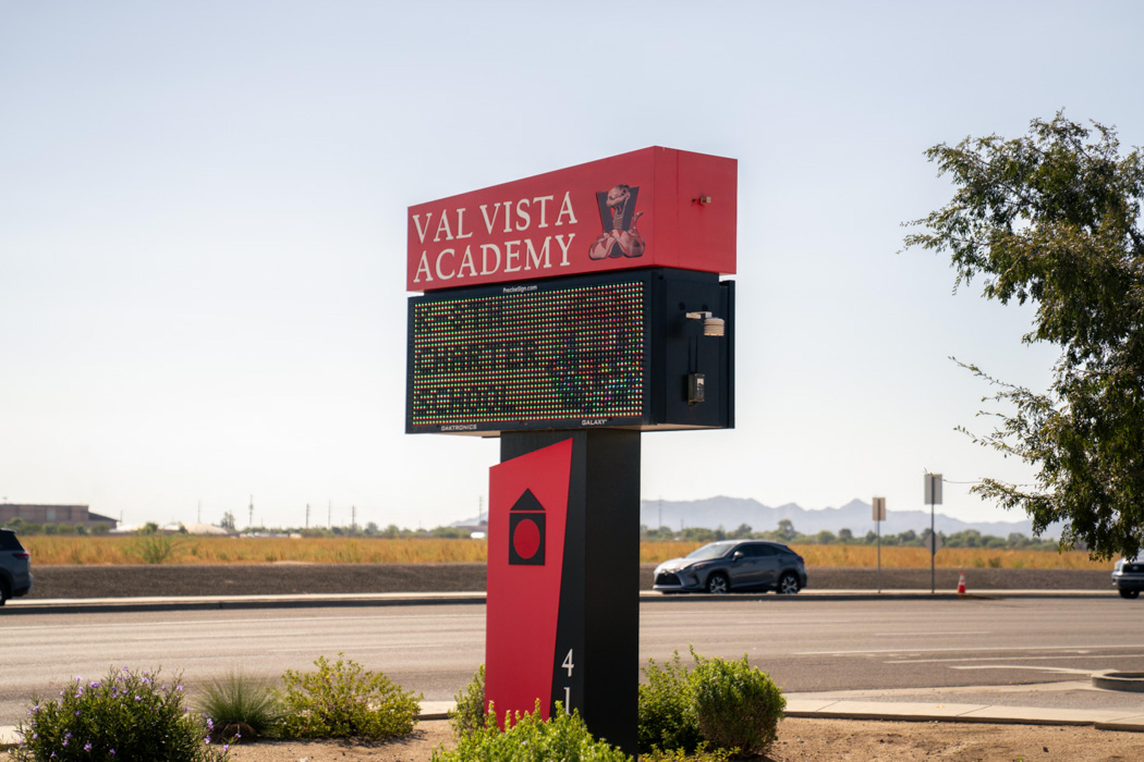 The Val Vista Academy sign welcomes students, families, and staff to a school community dedicated to learning, growth, and achievement.