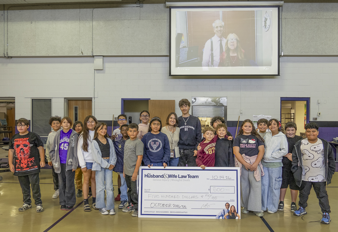 Mrs. Vargas-Portley celebrates her $500 Teacher of the Month award alongside students from Kearny Elementary, with Mark and Alexis Breyer joining the excitement over Zoom.