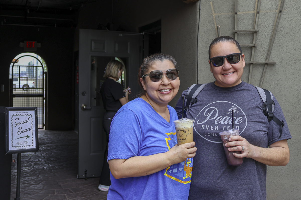 Two guests enjoy coffee and sunshine outside Social Bean Café & Bakery during the Husband & Wife Law Team’s HEART event. Coffee in hand and smiles all around at Social Bean Café & Bakery during the Husband & Wife Law Team’s weekday HEART event.