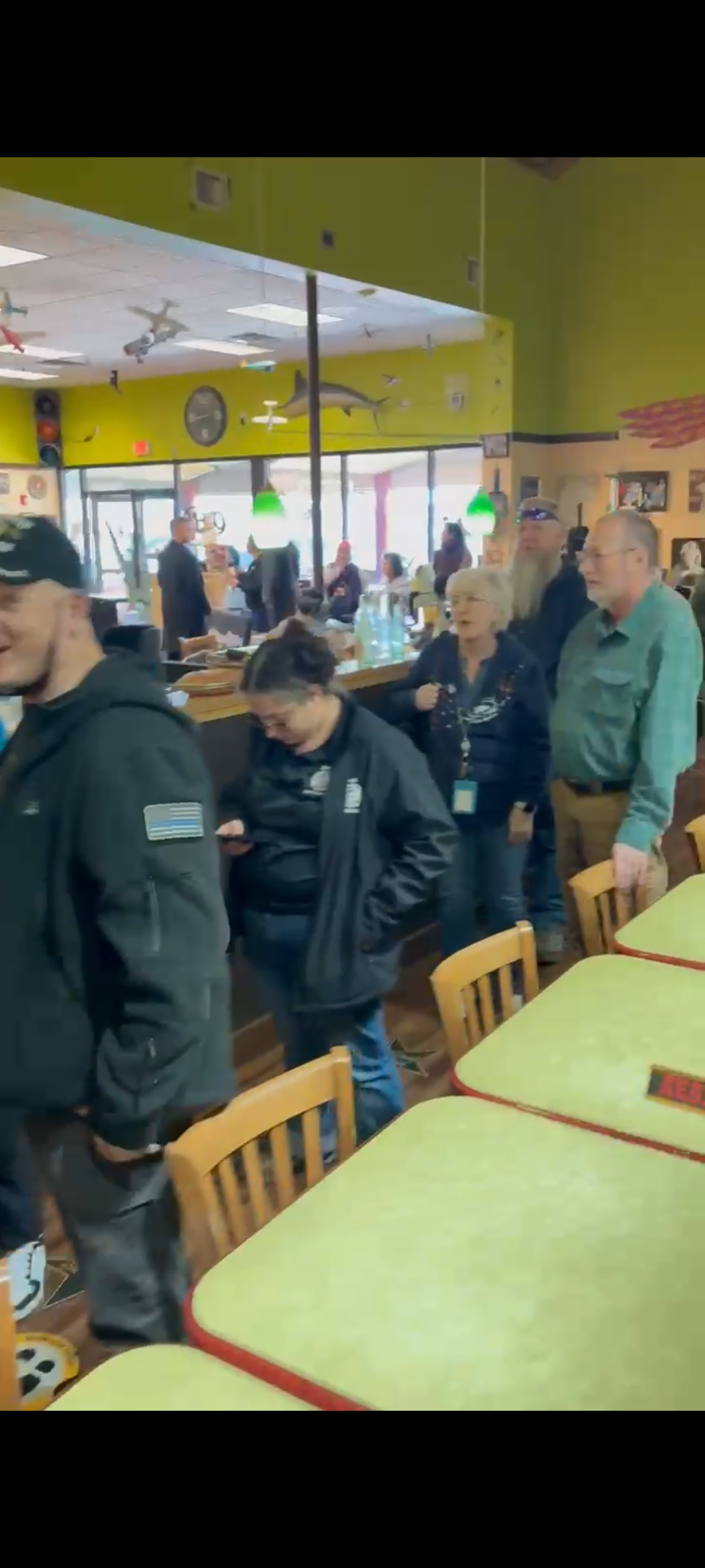 People are lined up inside The Grill  and waiting for a mesquite-grilled burger