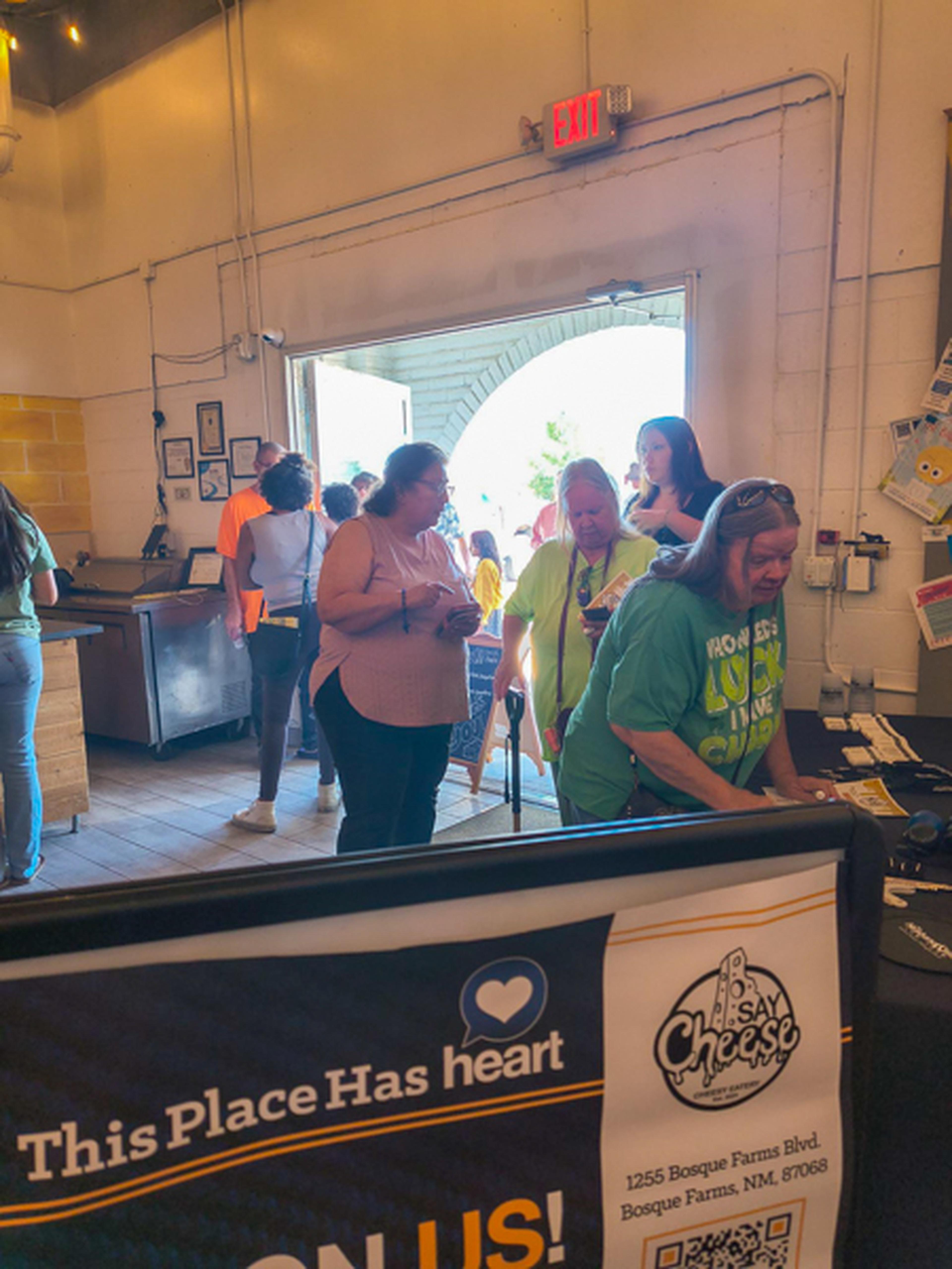 Attendees of the HEART free lunch arrive and start to enjoy the event