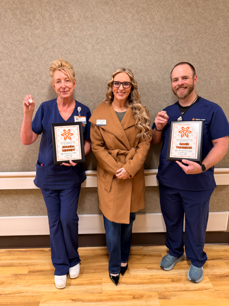 The Husband & Wife Team is truly honored to present Guardian Angel Awards to Rhonda and David, Jen from the Husband & Wife Law Team, standing next to Rhonda and David with their Guardian Angel Awards
