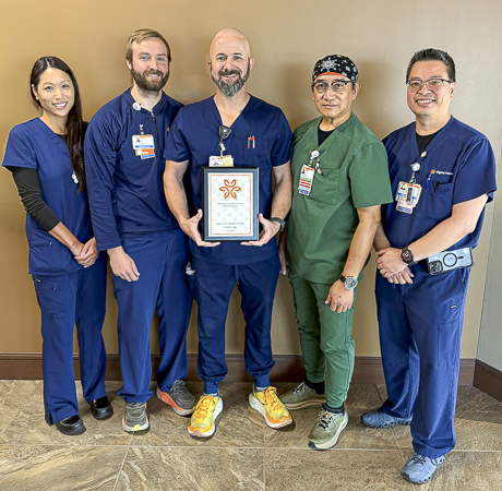 Celebrating the ICU Team as the Husband & Wife Law Team presents them with the Guardian Angel Award. Guardian Angel honor - The Husband & Wife Law Team honors the ICU Team with the Guardian Angel Award.