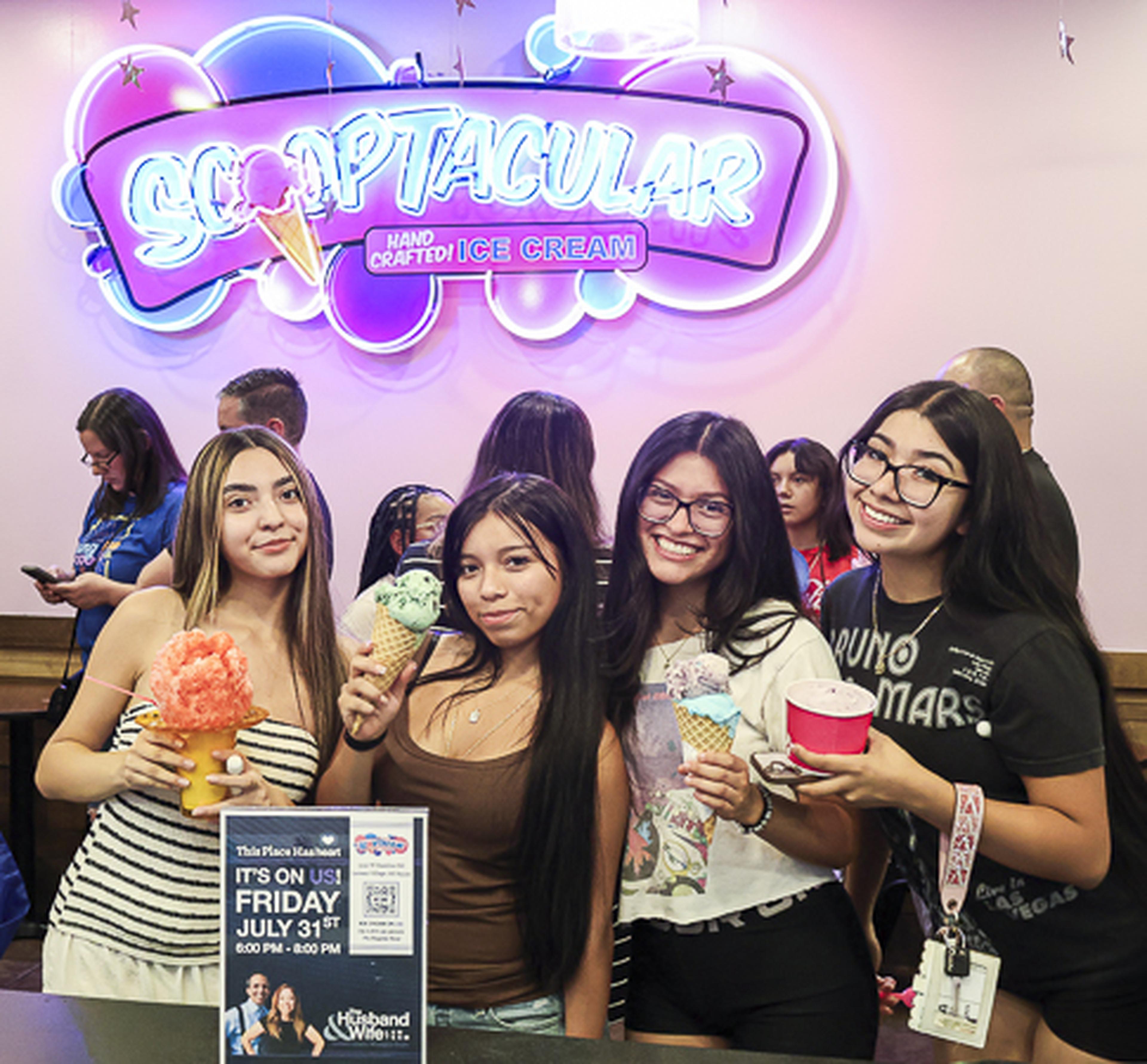 Four attendees enjoy ice cream and great company at the SCOOPTACULAR HEART Event, gathering for a fun-filled day of community connection and sweet treats.