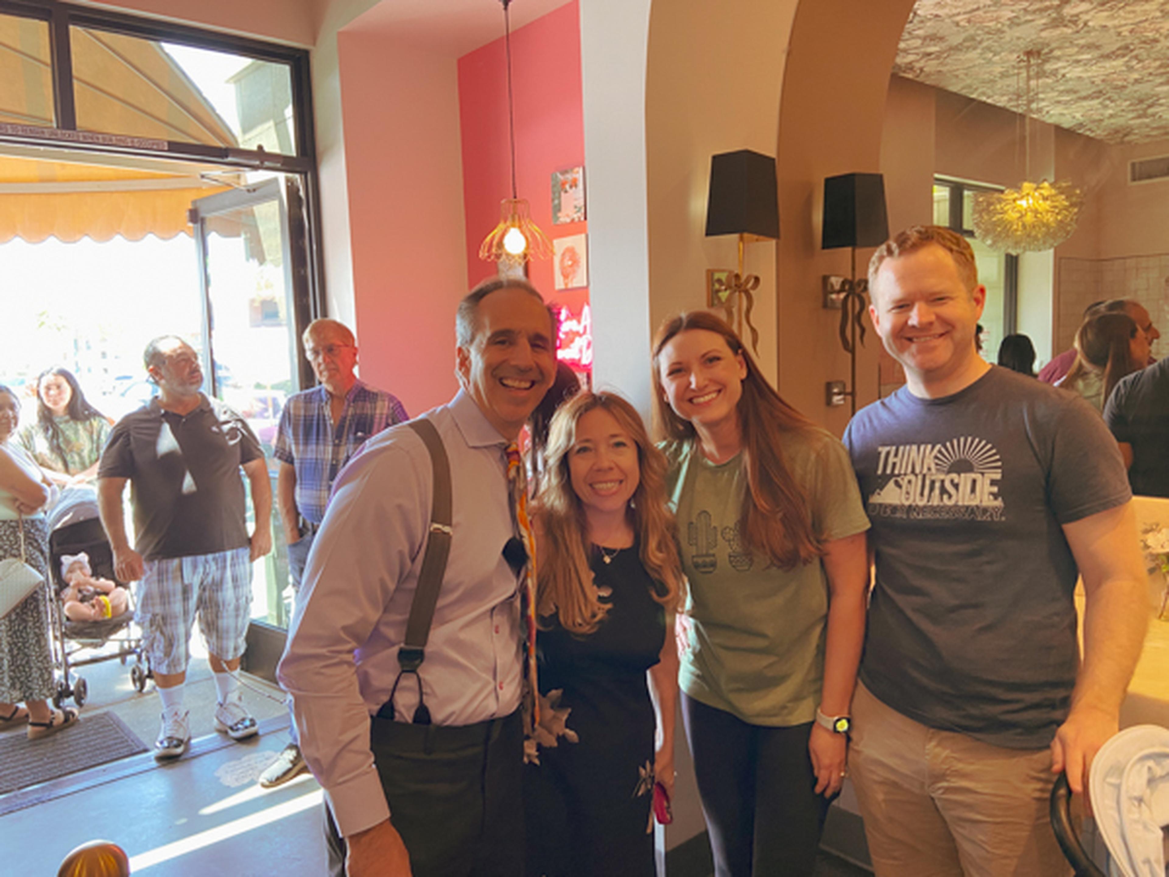 Smiling for a photo with Mark and Alexis Breyer at Sweet Dee's