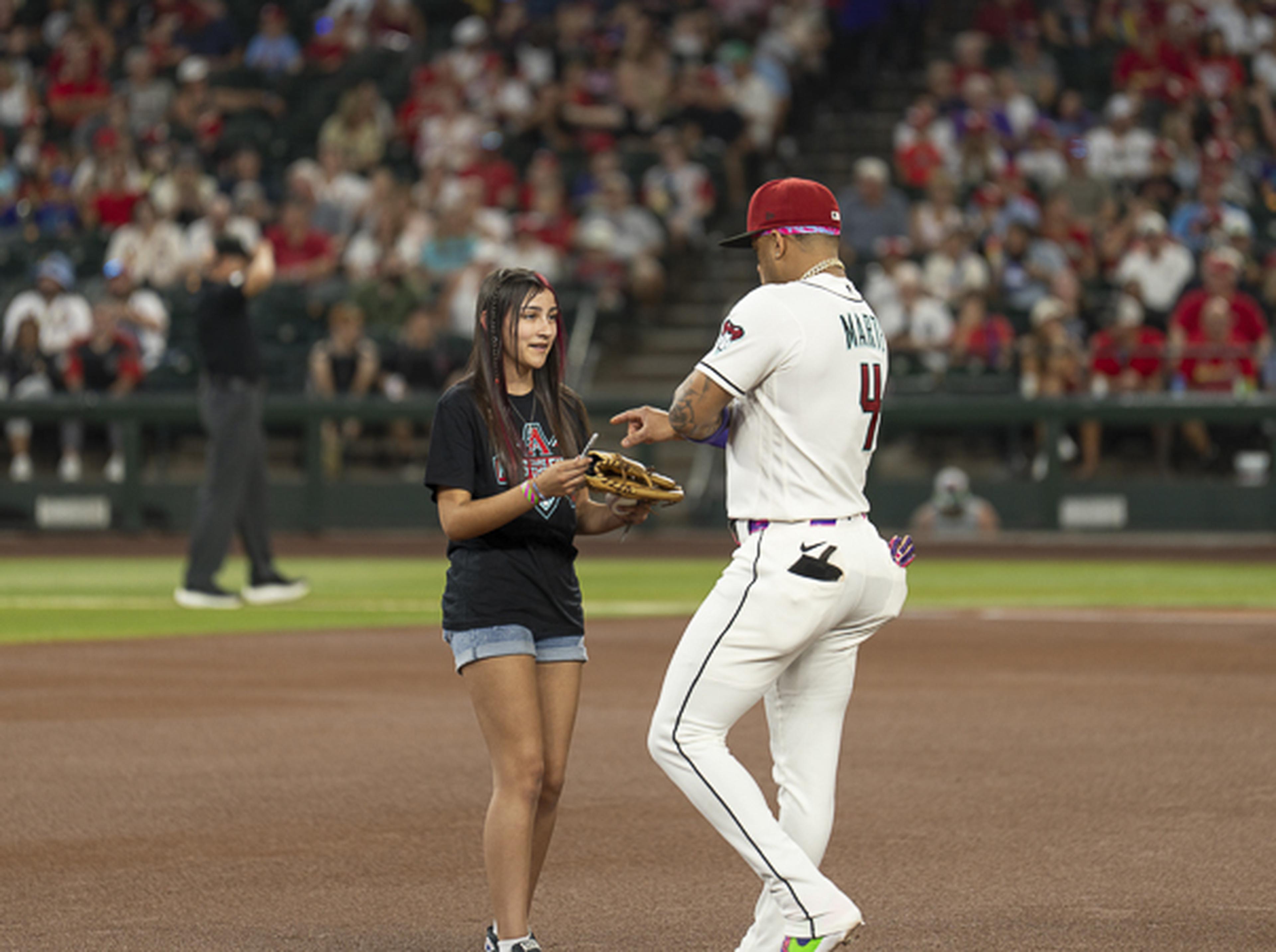 A young Diamondbacks fan shares a special moment on Chase Field with a D-backs player, creating memories that will last long after the final pitch.