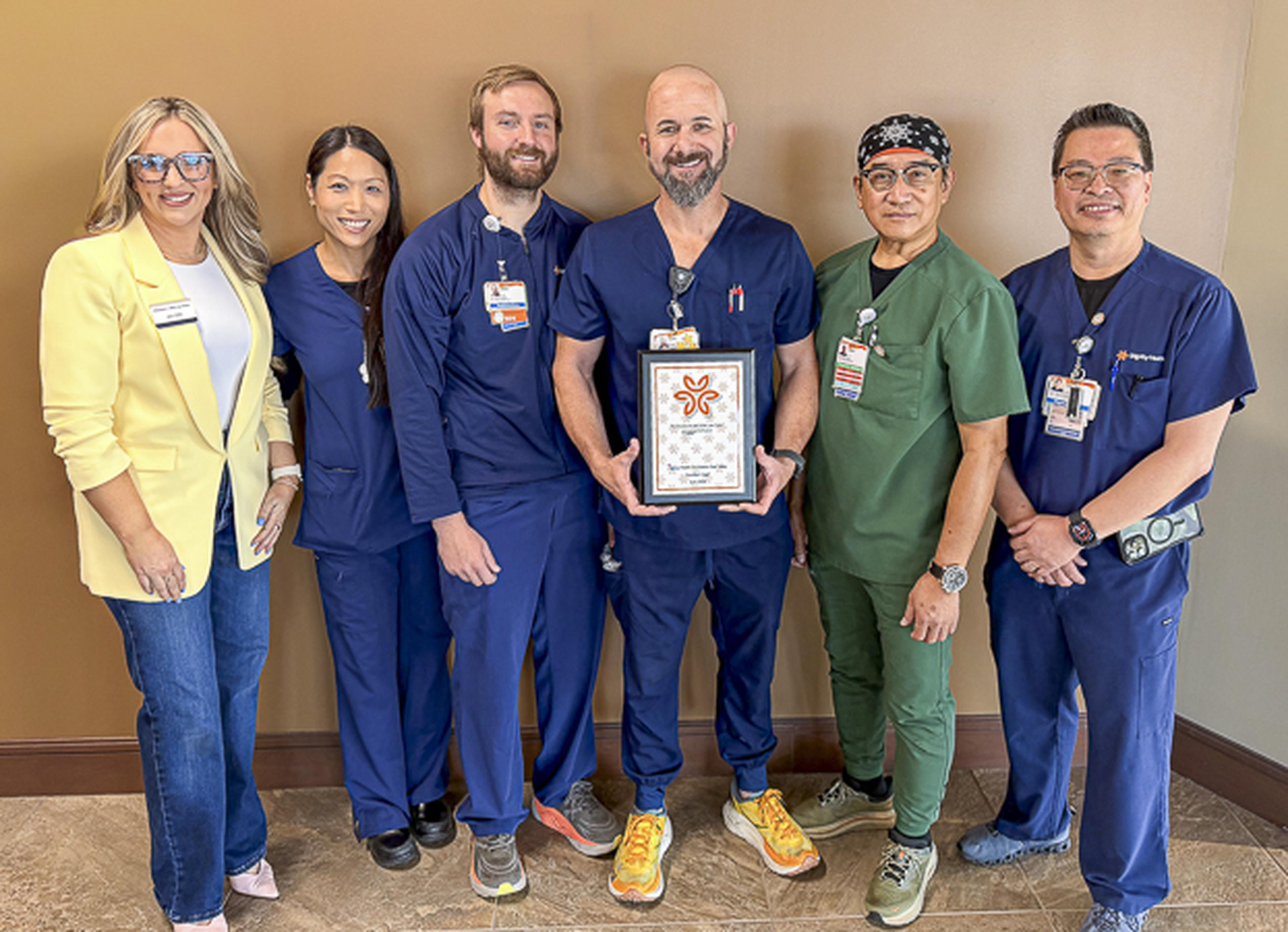 Jen from the Husband & Wife Law Team celebrates the ICU Team at Dignity Health with the Guardian Angel Award.