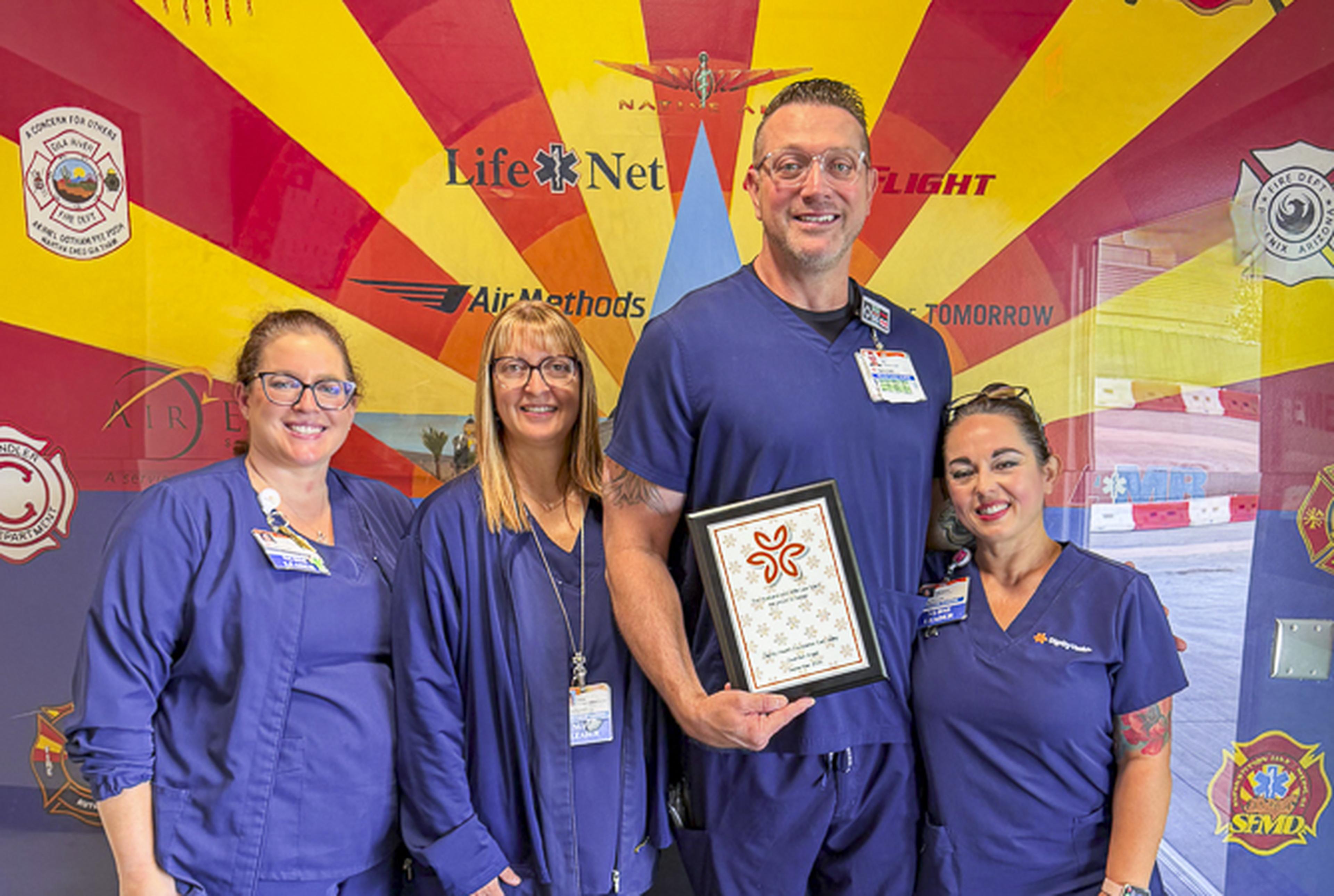 Smiles and appreciation fill the room as healthcare colleagues celebrate a Guardian Angel Award honoree for the outstanding care and support provided to patients and families.