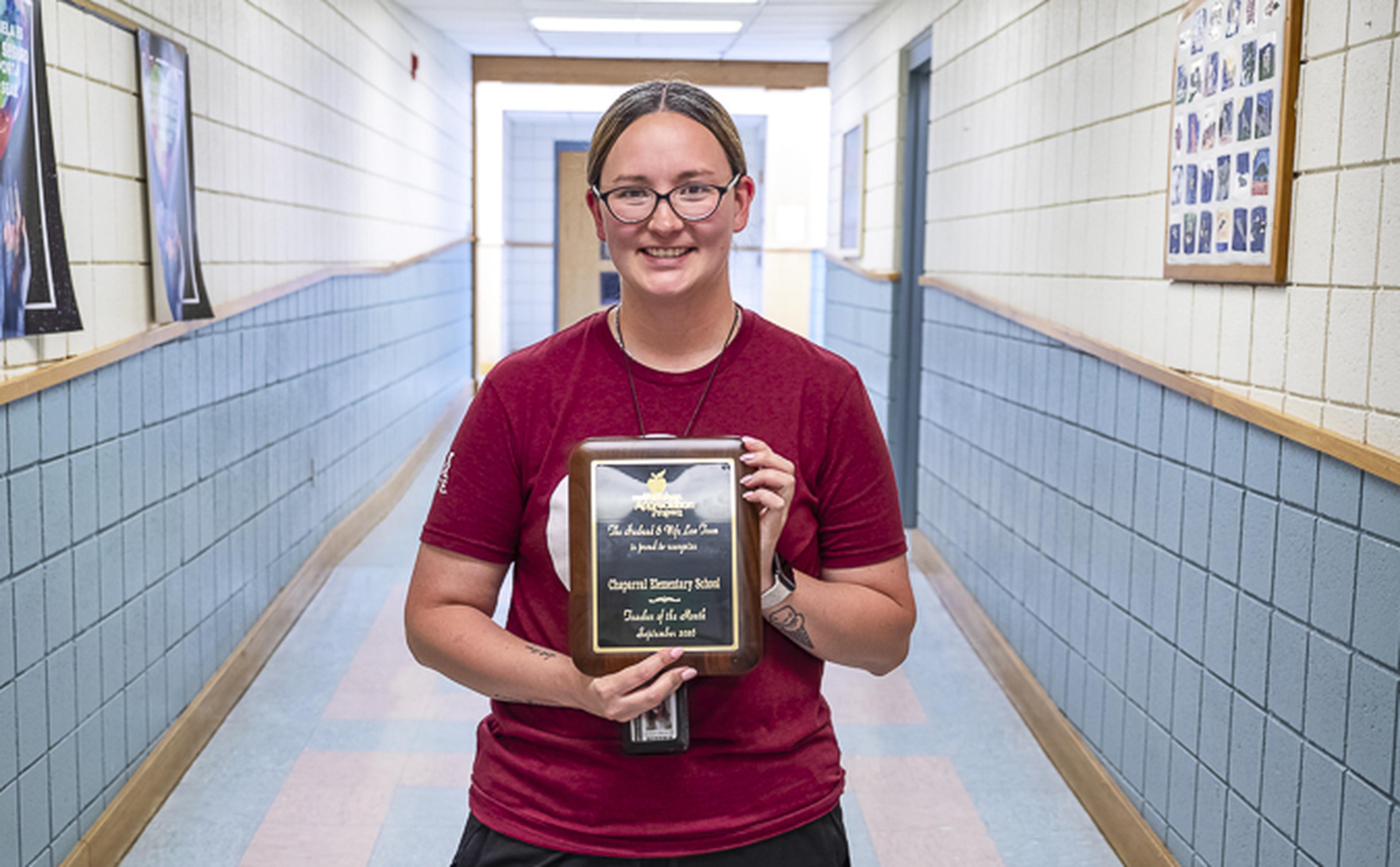 Ms. Quintana proudly displays her Teacher Appreciation Award at Chaparral Elementary School, recognizing her dedication to students and commitment to education.