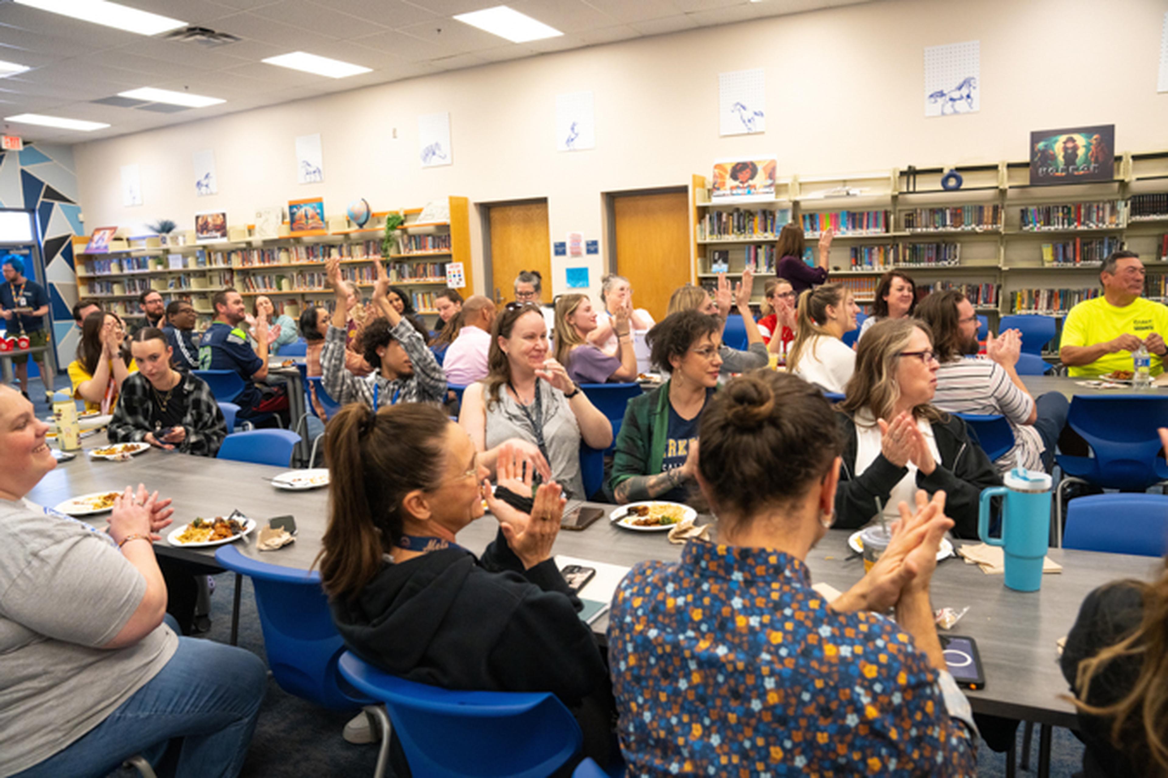 At the Mesquite Junior High Library, a joyful group sits together honoring Ms. Matalon for the dedication and care she pours into her school.
