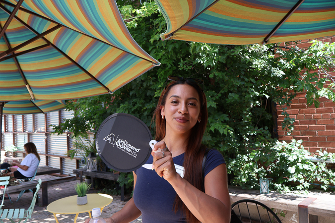 A Husband & Wife Law Team HEART event organizer shares a smile at Flagstaff Baking Co., helping connect with the community and promote local outreach efforts.