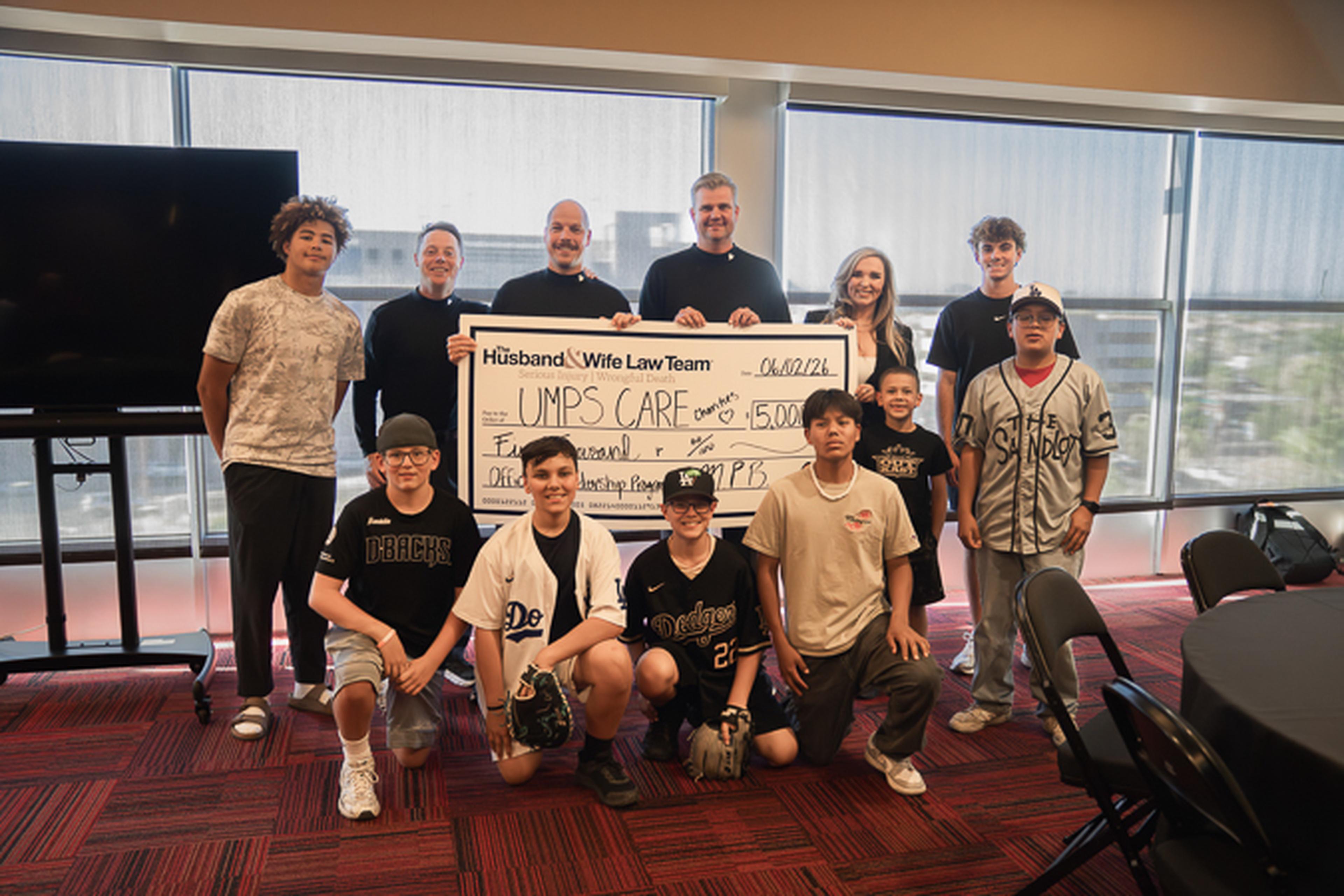 Inspiring young leaders to step up to the plate with a $15,000 UMPS CARE donation from the Husband & Wife Law Team.