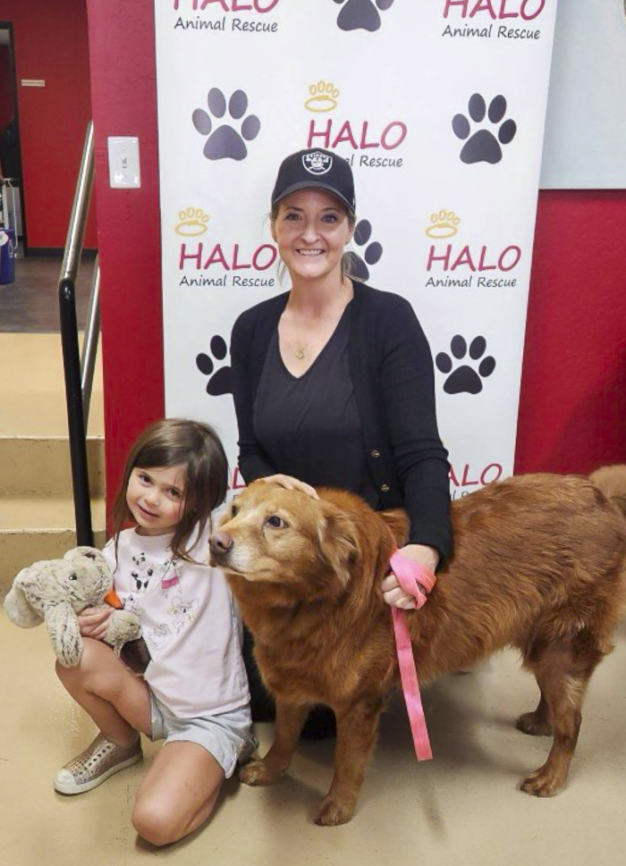 Smiles all around as a family welcomes a new furry companion at the Husband & Wife Law Team’s HALO Adoption Event, creating memories that will last a lifetime. A woman and young girl pose with their adopted dog at the Husband & Wife Law Team’s HALO Adoption Event, celebrating a special day and the start of a new journey together.