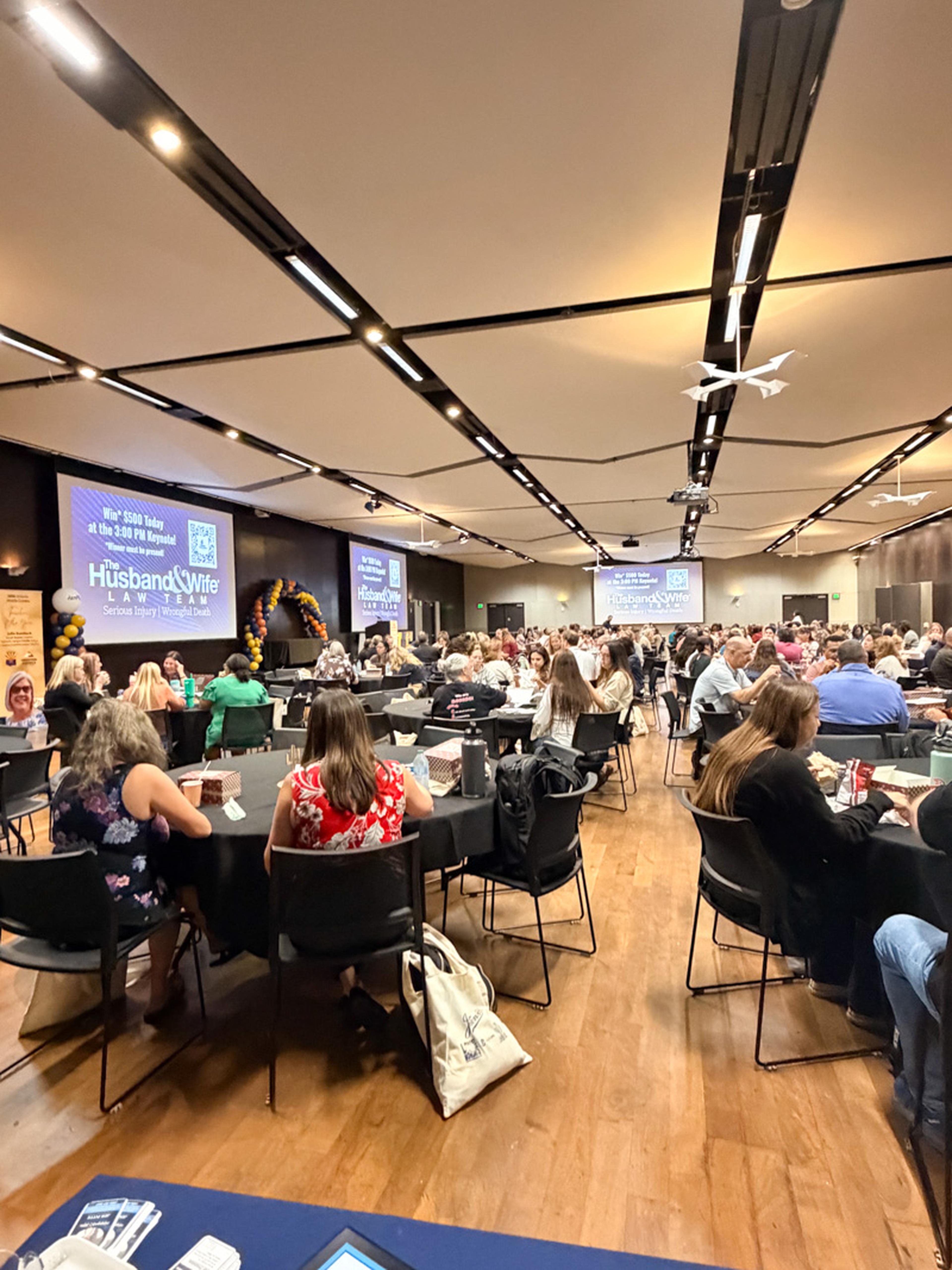 Attendees gather at the Arizona Middle Grades Summit at Arizona State University, where the Husband & Wife Law Team proudly supports and celebrates educators dedicated to student success.