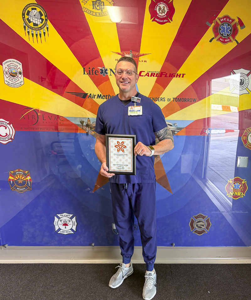 With a smile and his Guardian Angel Award in hand, Nurse Ryan is honored by the Husband & Wife Law Team for the exceptional care, kindness, and support he provides every day.