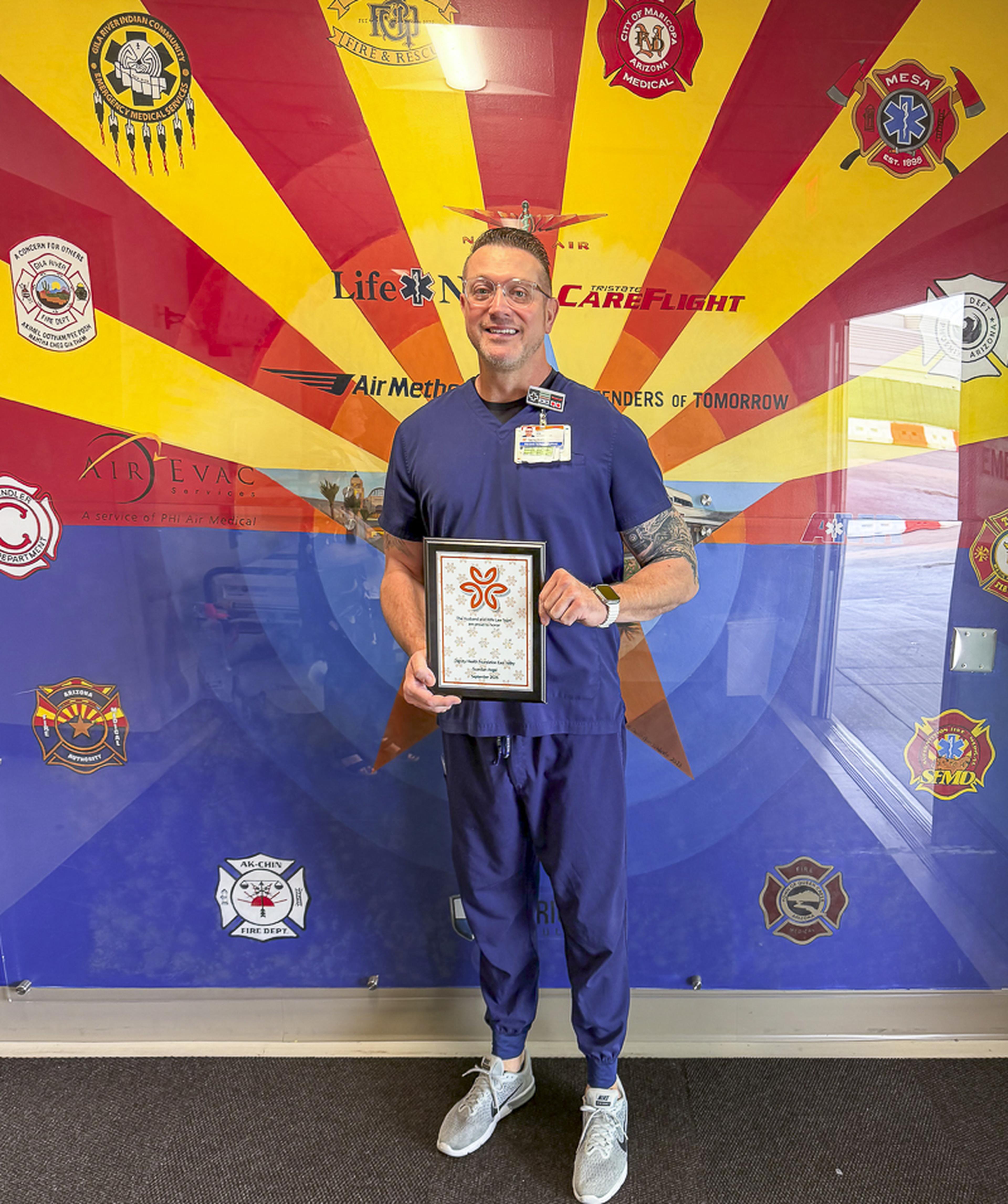 With a smile and his Guardian Angel Award in hand, Nurse Ryan is honored by the Husband & Wife Law Team for the exceptional care, kindness, and support he provides every day.