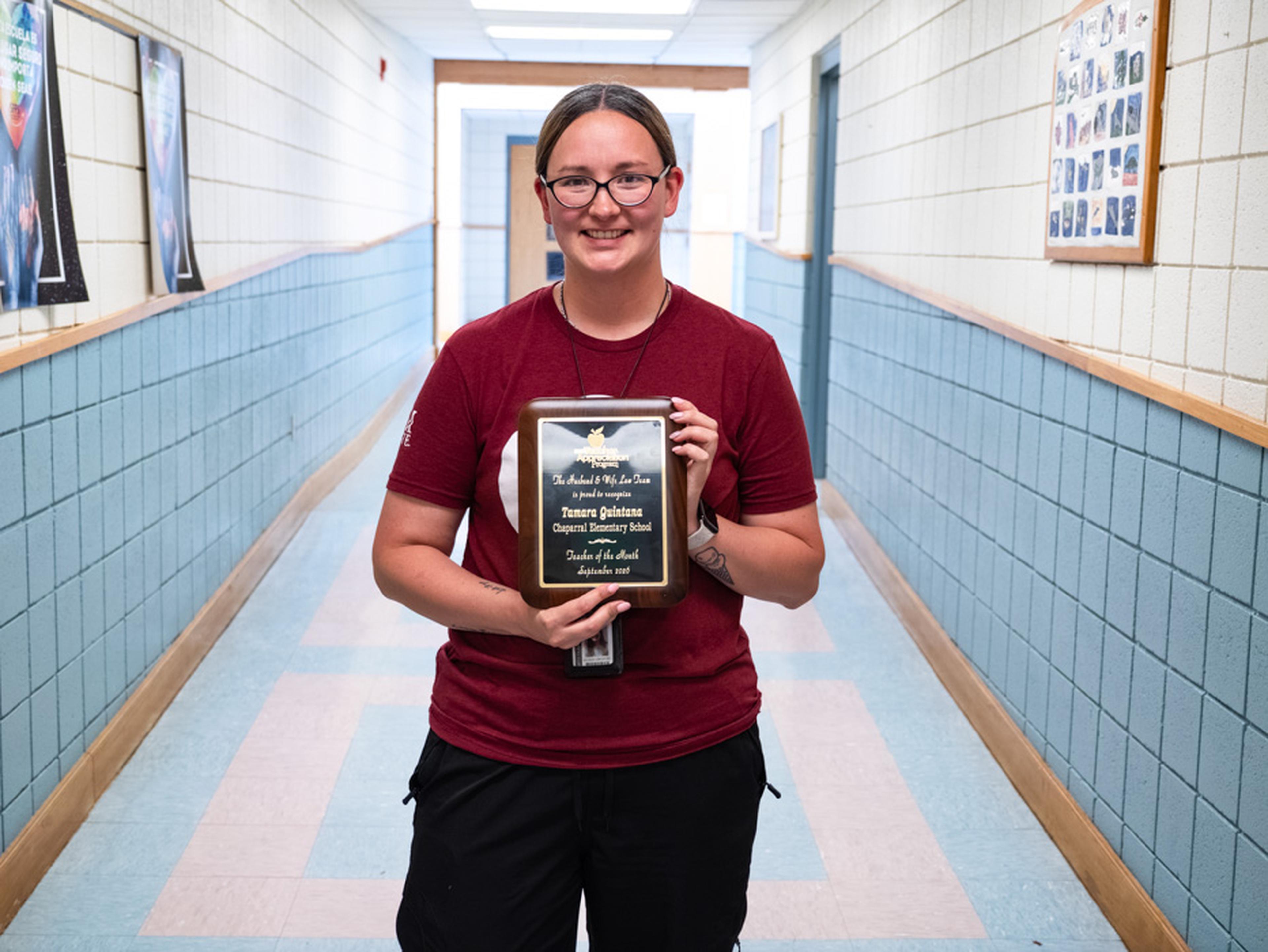 Ms. Quintana proudly displays her Teacher Appreciation Award at Chaparral Elementary School, recognizing her dedication to students and commitment to education.