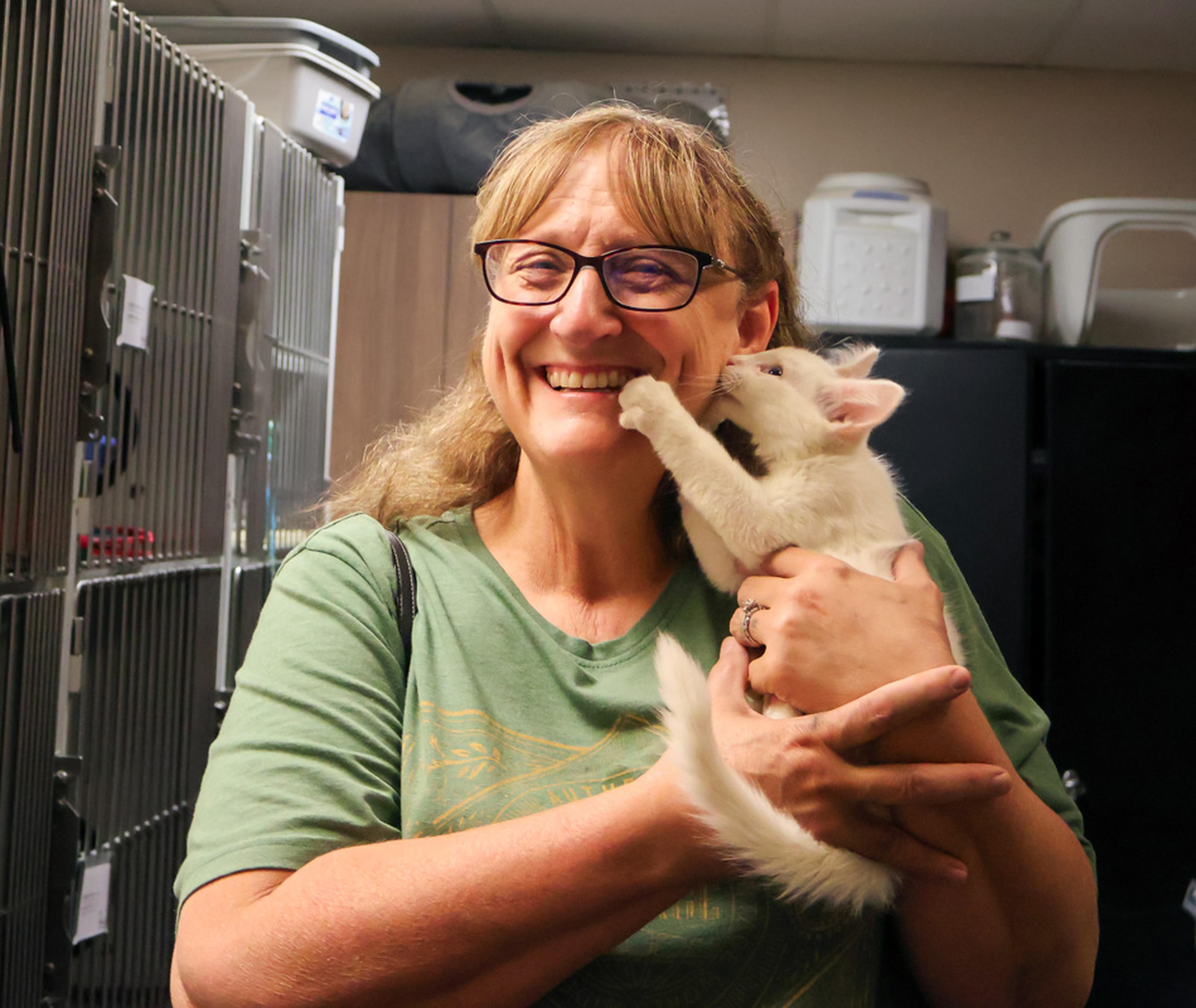 Smiles and kitten cuddles go hand in hand at the Husband & Wife Law Team’s HALO Adoption Event, where attendees had the chance to meet adorable cats looking for a loving family.