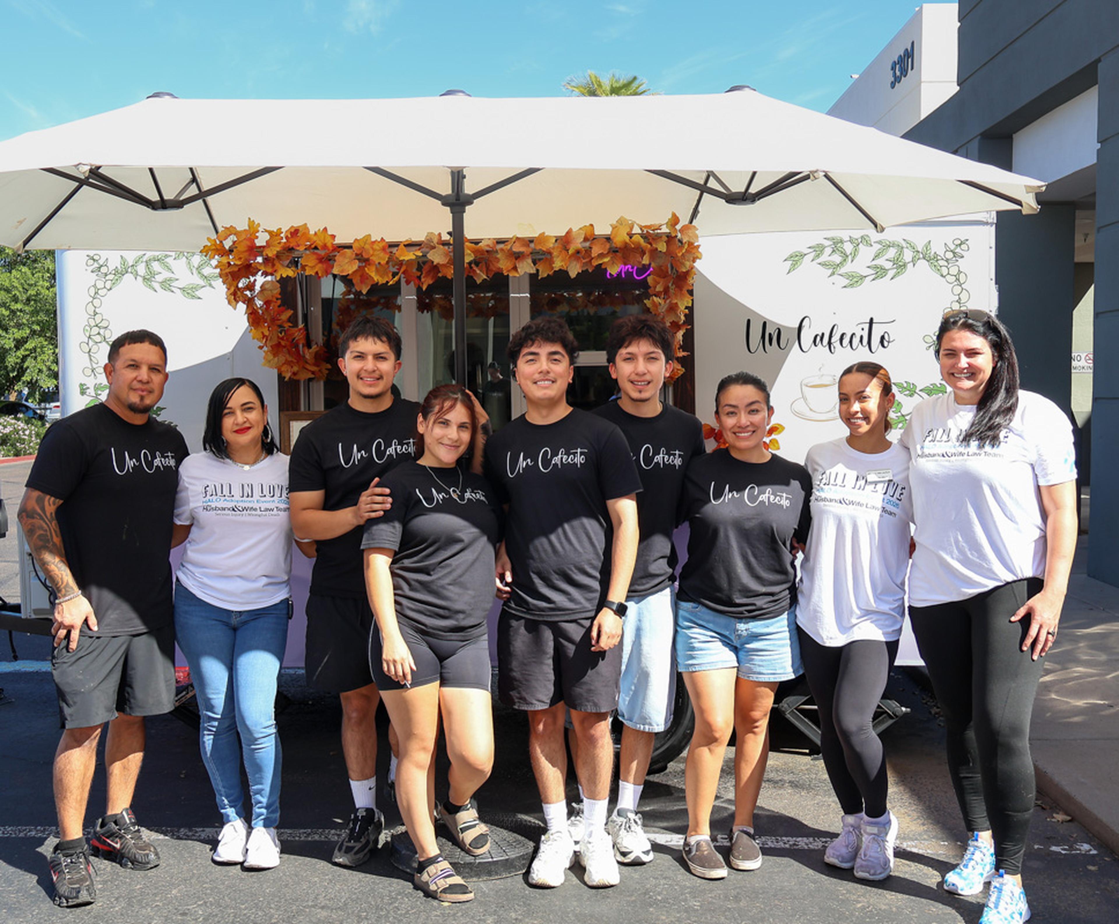 Posing together in front of the Un Cafecito coffee truck, volunteers and supporters help make the Husband & Wife Law Team’s HALO Adoption Event a memorable day for families, animal lovers, and adoptable pets.