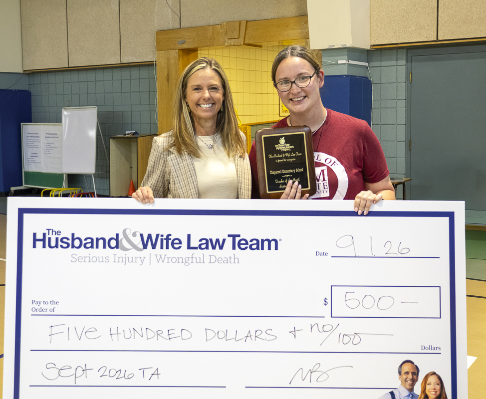 Ms. Quintana proudly displays her Teacher Appreciation plaque and $500 award from the Husband & Wife Law Team, recognizing her outstanding dedication to students at Chaparral Elementary School.