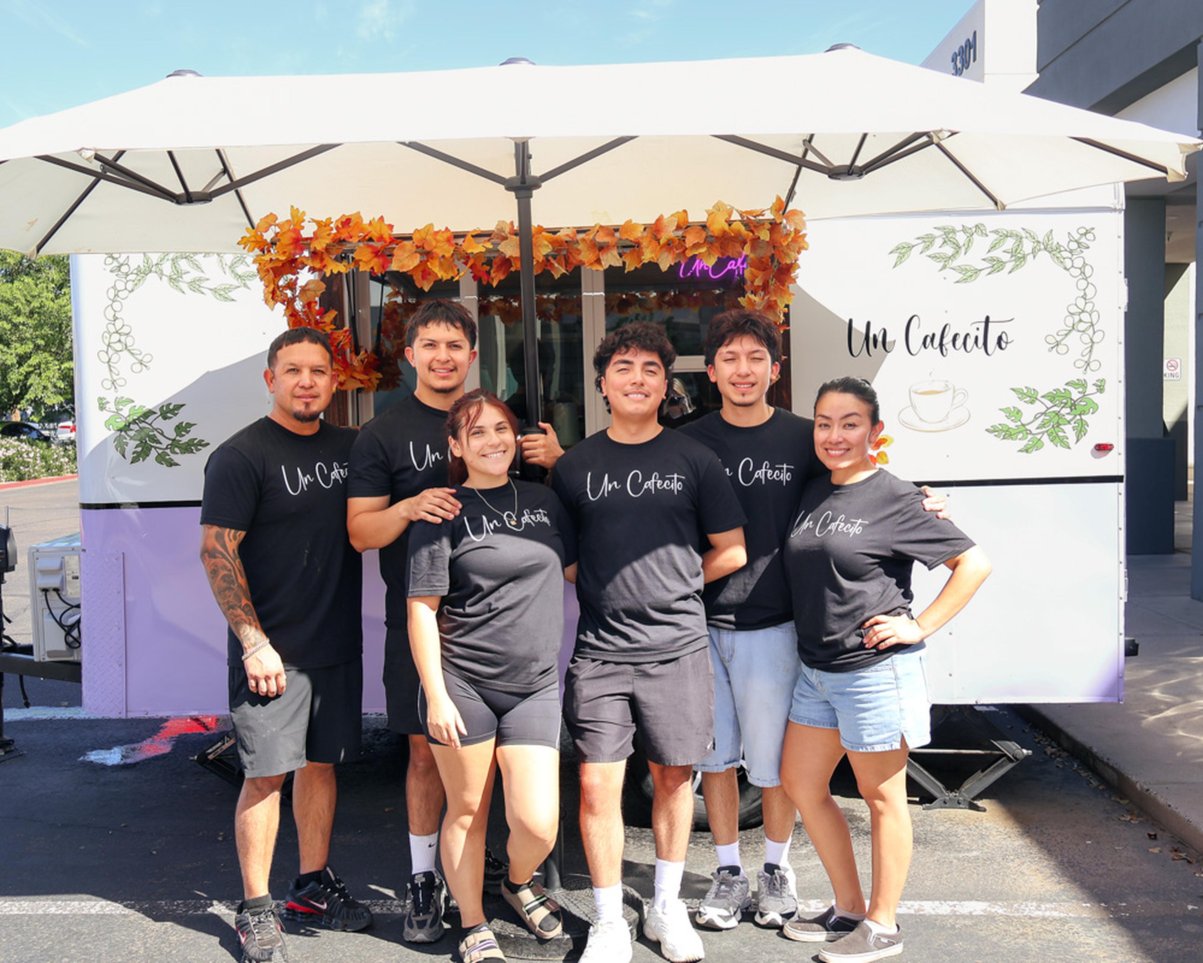 The Un Cafecito team gathers in front of their coffee truck during the Husband & Wife Law Team’s HALO Adoption Event, helping create a welcoming atmosphere for families, pet lovers, and community members.