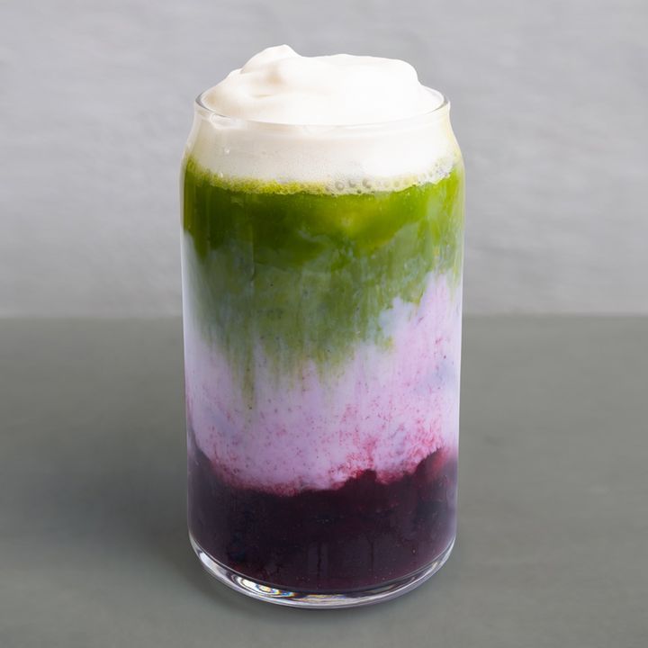A layered matcha with housemade blueberry syrup, creamy organic oat milk, and premium organic matcha layers topped with frothy cold foam.